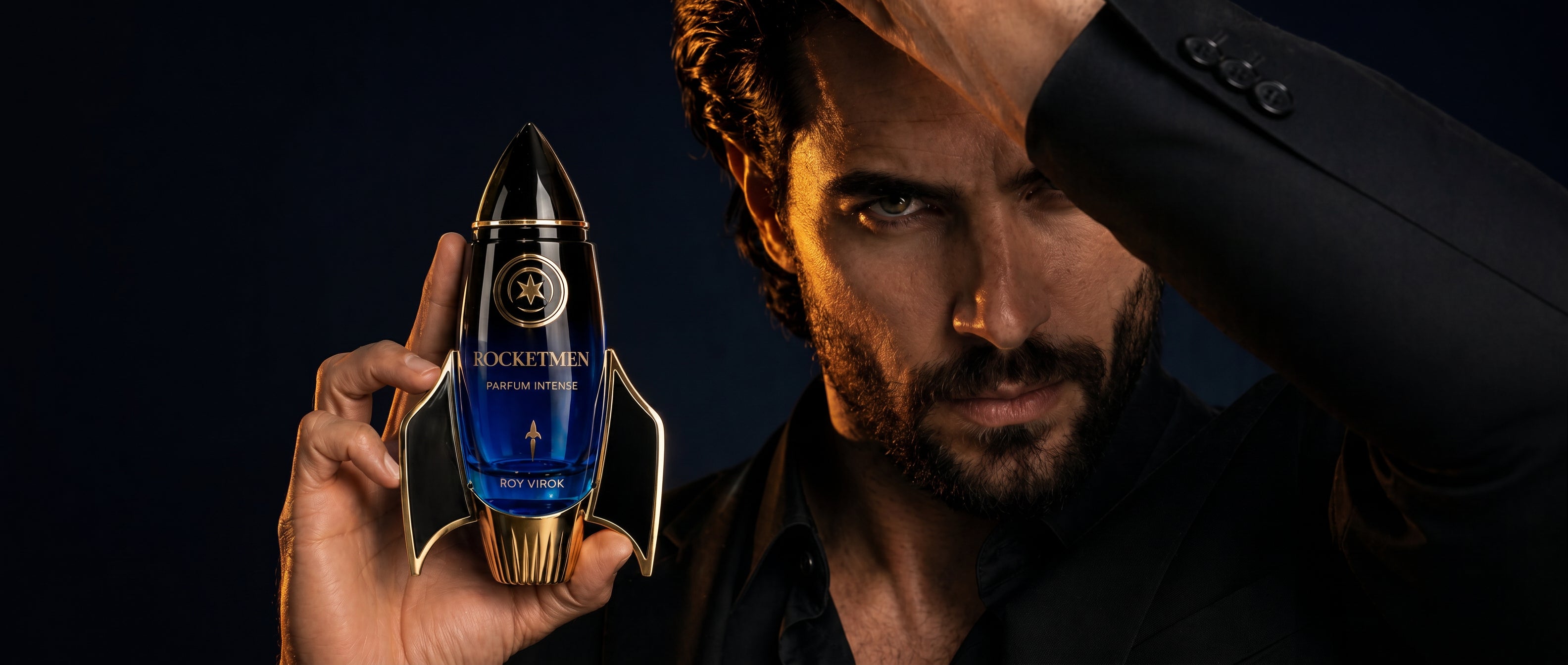 ROY VIROK ROCKETMEN Parfum Intense rocket-shaped perfume bottle held by an elegant man in a luxury fragrance campaign.