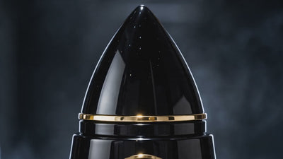 Cinematic video of ROY VIROK ROCKETMEN 100 ml Parfum Intense, showing its rocket-shaped perfume bottle, deep blue glass and metallic gold details.